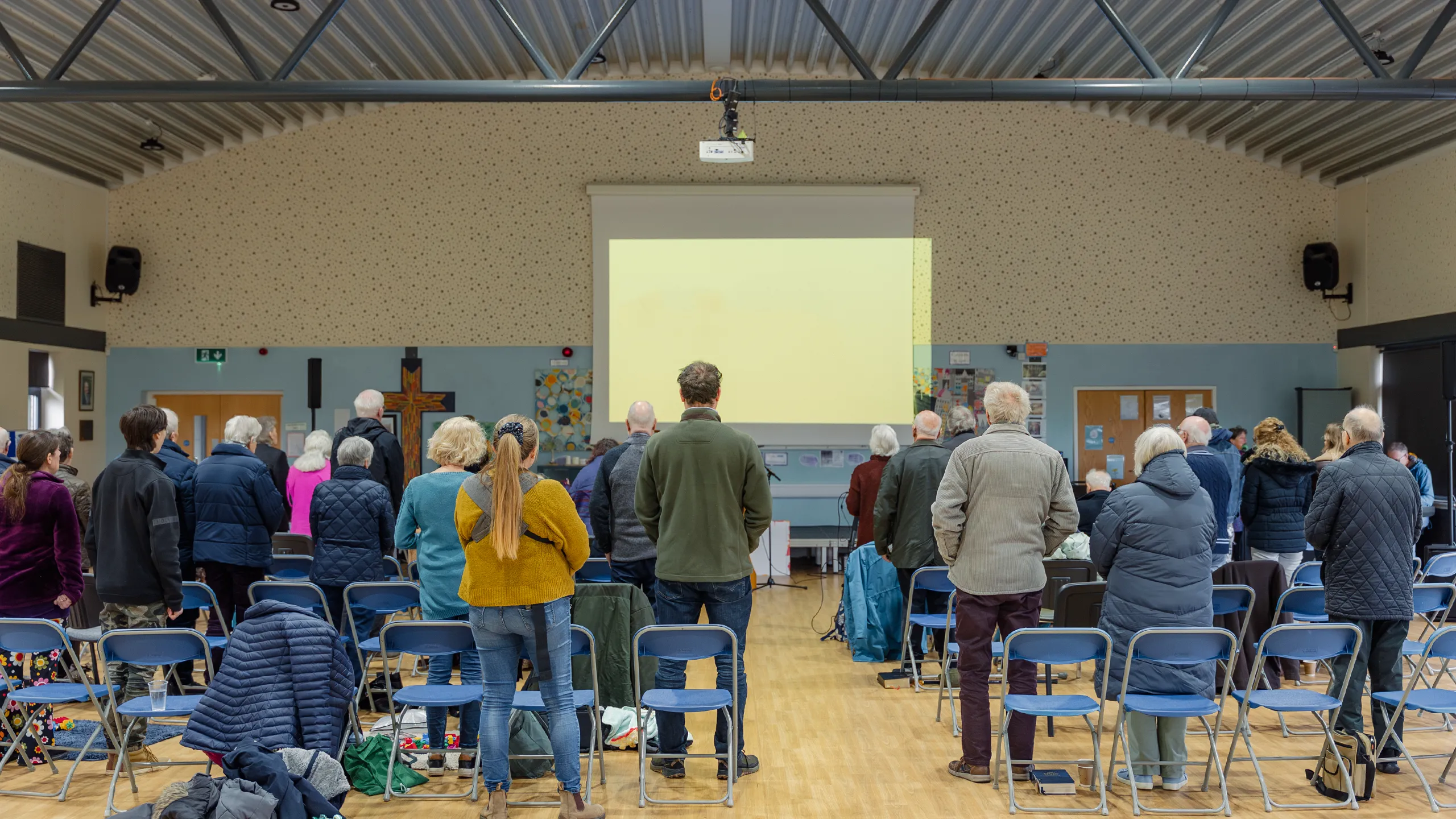 People gathered together in a church hall